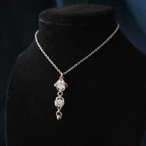 Whimsical fairy caged quartz and silver rosary pendant necklace